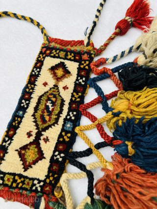Rare Antique Qashqai Knee Bands | Circa 1880

This exceptional pair of antique Qashqai knee bands, dating back to around 1880, is a rare find. The bands retain their original braided cords and  ...