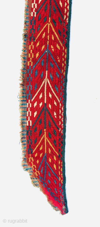 “An early 19th-century Tekke Turkmen embroidered band, featuring intricate abstract motifs in shades of red, blue, yellow, white, dark green, and apricot yellow. This embroidery is entirely silk, stitched onto a red-brown  ...