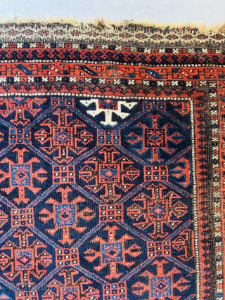 Baluch Masnad (sitting rug) circa 1880, featuring gorgeous shades of blue, white, red, and natural brown wool, oxidized in some areas. Beautiful flatwoven ends (weft floating technique), all wool. One very small  ...
