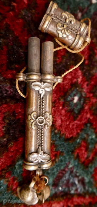 Antique Tibetan needle case;   brass and copper with 'wisdom eyes' in silver;  19th c.  5".  Amazing piece and rare.

SOLD         