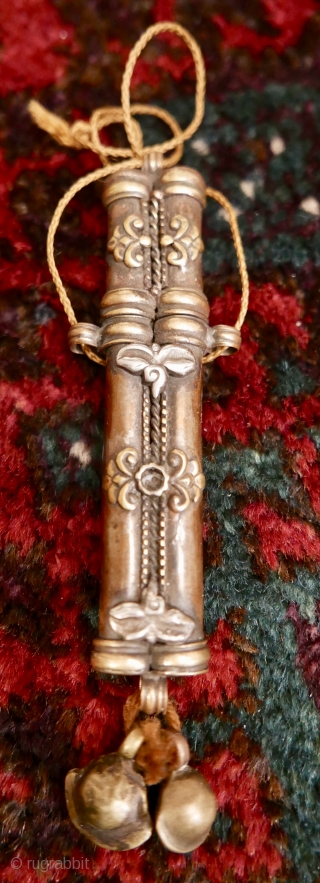 Antique Tibetan needle case;   brass and copper with 'wisdom eyes' in silver;  19th c.  5".  Amazing piece and rare.

SOLD         