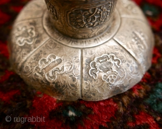 18th-19th c Tibetan silver teacup holder (dkar yol yu),  lid (kha leb)and cup (phor pa) with very finely chased and repousse-worked Buddhist auspicious symbols and a splayed lotus fineal surmounted by  ...