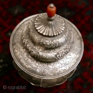 18th-19th c Tibetan silver teacup holder (dkar yol yu),  lid (kha leb)and cup (phor pa) with very finely chased and repousse-worked Buddhist auspicious symbols and a splayed lotus fineal surmounted by  ...