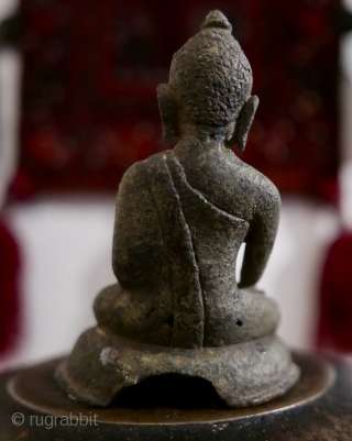 Antique bronze miniature Burmese Buddha sitting in Bhumisparsha mudra posture.  Extremely old - 16th c?  older?.  Most likely excavated from beneath a stupa in old Burma.  3 1/2"H

SOLD 