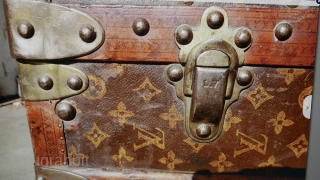 Authentic LOUIS VUITTON Monogram Steamer Trunk.  Manufactured in France over a hundred years ago. Instantly recognized by the famous monogram adorning all sides. Brass hardware and wheels, canvas, and leather trim.  ...
