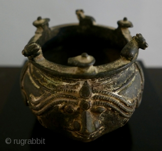 Shaivite Sacred Ash Bowl;  S India;  Brass;  19th c. or older.   Adorned with Shiva's symbols -  the Bull, Nandi, the Llingam, the Trident,  the Sun  ...