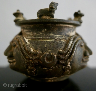 Shaivite Sacred Ash Bowl;  S India;  Brass;  19th c. or older.   Adorned with Shiva's symbols -  the Bull, Nandi, the Llingam, the Trident,  the Sun  ...