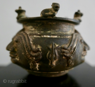 Shaivite Sacred Ash Bowl;  S India;  Brass;  19th c. or older.   Adorned with Shiva's symbols -  the Bull, Nandi, the Llingam, the Trident,  the Sun  ...