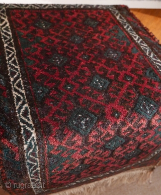 This is a very plush Baluch 'ballsht' with a high and lustrous pile,  blanket-like;  colors - two of aubergine, blue-green,  reddish-orange and white - are deep,  rich and  ...