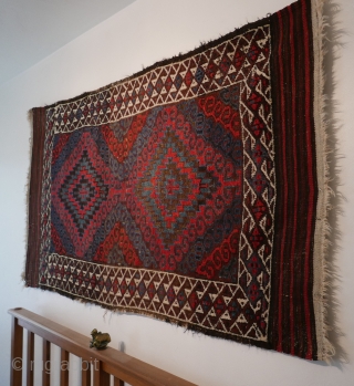 Mushwani Belouch/Baluch,  circa 1900,  2'10"x5'6",  wild and beautiful, with vivid red,  blue,  aubergine and white;  symmetrically knotted; kilim ends are complete except for small rough spot  ...