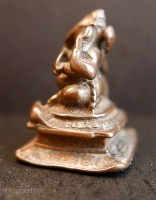 18th c Hindu icon 'GANESH';  bronze;  1 3/4"H or 4.4cm

'Ganesh' is the Hindu 'god of beginnings',  'remover of obstacles',   he takes precedence at the opening of rites  ...