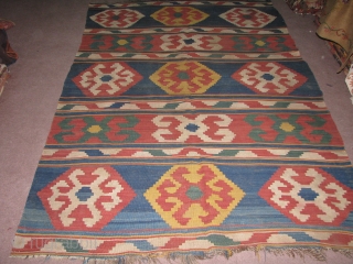 Caucasian Kilim.Very fine weave,quality,wool and all good naturel colours.The green,yellow,blue and other colours are just in a great harmony.2,42mX1,60m.(Original Size).Please feel free to contact me.Thank you       