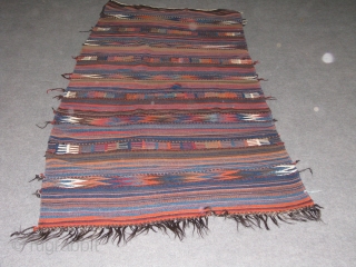 Very lovely wedding(dowry) kilim.Veramin?.it has great colours.the weave is very tite(strong)and between the designed parts to stripe simple parts it has extra embrodry.the base is either goat hair,horse hair?the piece is quite  ...