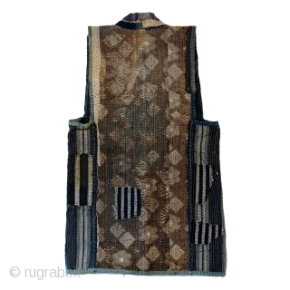 Sashiko Boro Noragi - Sodenashi with Dense Repairs

Extreme sashiko stitching over this vest.

Rustic antique cottons.

Years of use give this sodenashi a very soft feel. 

Suitable for display or wear. 

Early 1900's
Dimensions: 13"  ...