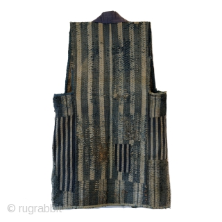 Sashiko Boro Noragi - Sodenashi with Dense Repairs

Extreme sashiko stitching over this vest.

Rustic antique cottons.

Years of use give this sodenashi a very soft feel. 

Suitable for display or wear. 

Early 1900's
Dimensions: 13"  ...