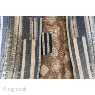 Sashiko Boro Noragi - Sodenashi with Dense Repairs

Extreme sashiko stitching over this vest.

Rustic antique cottons.

Years of use give this sodenashi a very soft feel. 

Suitable for display or wear. 

Early 1900's
Dimensions: 13"  ...