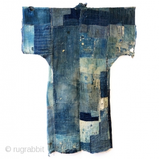 Boro Yogi - Meiji Era Indigo Yogi

An antique heavily worn, repaired and weathered, museum quality boro yogi.

This piece balances a blend of what most collectors seek in boro - a visual aesthetic  ...