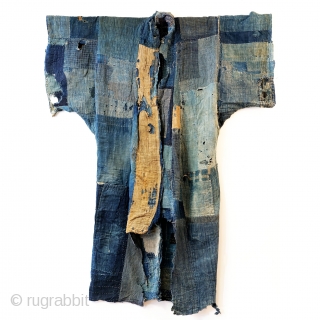 Boro Yogi - Meiji Era Indigo Yogi

An antique heavily worn, repaired and weathered, museum quality boro yogi.

This piece balances a blend of what most collectors seek in boro - a visual aesthetic  ...