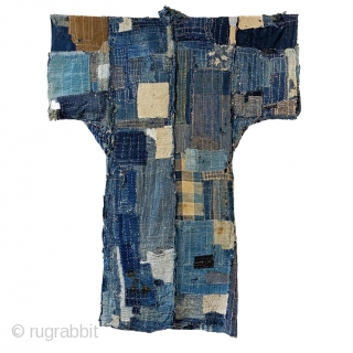 Boro Yogi - Meiji Era Indigo Yogi

An antique heavily worn, repaired and weathered, museum quality boro yogi.

This piece balances a blend of what most collectors seek in boro - a visual aesthetic  ...