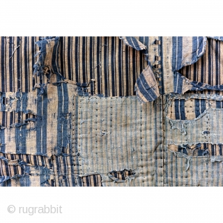 A tattered and stunning Japanese boro work jacket, or noragi. 

Layers of shima striped cottons give way to more stripes. 

Suitable for display or wear, this is one of our favorite jackets  ...