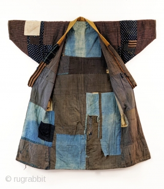 Heavily patched boro noragi displays years of use. 

Outer jacket shows a handsome display of variegated indigo cottons, stripes and checks.

Inner work coat has brilliant yellow sleeves and sashiko stitching.

In excellent overall  ...