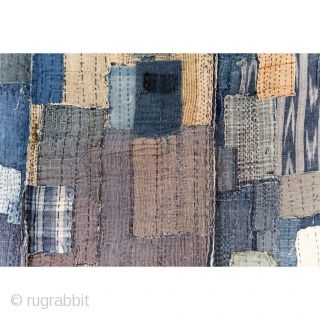 Boro Futon - Antique Indigo Cottons with Dense Sashiko Stitching

Extensive sashiko stitching.

A wide variety of textiles have been used to create this futon. Mostly double layered, heavy weight cotton fabrics. 

This textile  ...