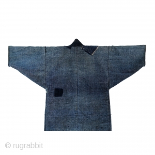 Boro Noragi - Meiji-era Indigo Cotton and Hemp Blend.

Thick, handspun indigo noragi with many mending patches. 

This jacket is heavy and warm and shows many, many years of use, but it still  ...