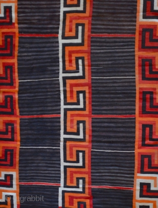 A gorgeous Navajo Transitional blanket (1880-1910) tightly woven in handspun native wool, in natural brown and ivory, indigo and aniline colors, with a variant Chief's design, c1880.

condition excellent

96" x 62"   