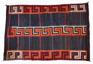 A gorgeous Navajo Transitional blanket (1880-1910) tightly woven in handspun native wool, in natural brown and ivory, indigo and aniline colors, with a variant Chief's design, c1880.

condition excellent

96" x 62"   