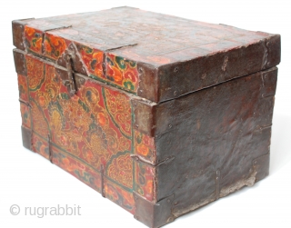 18c embossed zeebag chest, with a central medallion of the mythical zeebag beast and a reddish-orange background with swirls of light yellowish-brown. The painted surface on leather binding is raised lacquer gesso  ...