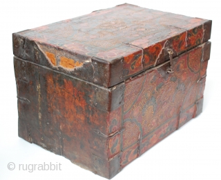 18c embossed zeebag chest, with a central medallion of the mythical zeebag beast and a reddish-orange background with swirls of light yellowish-brown. The painted surface on leather binding is raised lacquer gesso  ...