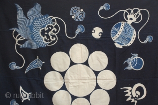A wonderful large Tsutsugaki Furoshiki indigo dyed hand-spun cotton printed design of a family crest. 
This is an old furoshiki, a square-shaped cloth that was used all over Japan for wrapping, hauling  ...