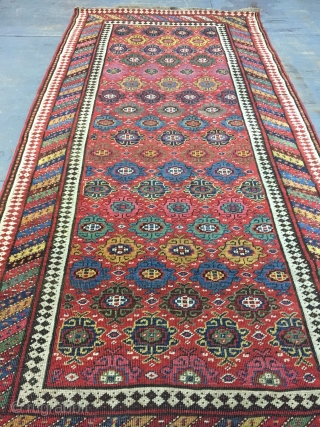 Good Kurdish long rug woven on a wool foundation, Bijar area north west Persia,last quarter 19th ,century,8ft.2in.x4ft.1in.2.49cm.x1.25cm.overall wear with corrosion to Browns,losses to both ends.unusual all over design of rosettes in a  ...