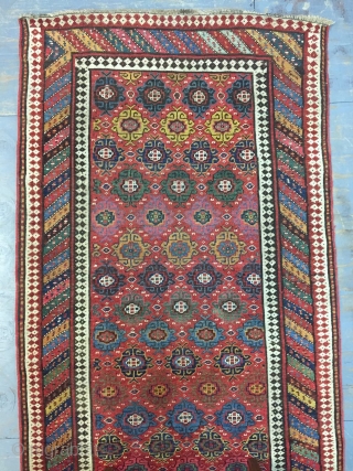 Good Kurdish long rug woven on a wool foundation, Bijar area north west Persia,last quarter 19th ,century,8ft.2in.x4ft.1in.2.49cm.x1.25cm.overall wear with corrosion to Browns,losses to both ends.unusual all over design of rosettes in a  ...