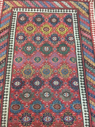 Good Kurdish long rug woven on a wool foundation, Bijar area north west Persia,last quarter 19th ,century,8ft.2in.x4ft.1in.2.49cm.x1.25cm.overall wear with corrosion to Browns,losses to both ends.unusual all over design of rosettes in a  ...