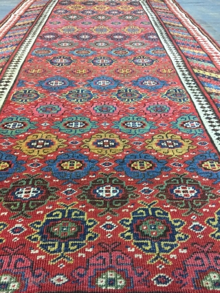 Good Kurdish long rug woven on a wool foundation, Bijar area north west Persia,last quarter 19th ,century,8ft.2in.x4ft.1in.2.49cm.x1.25cm.overall wear with corrosion to Browns,losses to both ends.unusual all over design of rosettes in a  ...