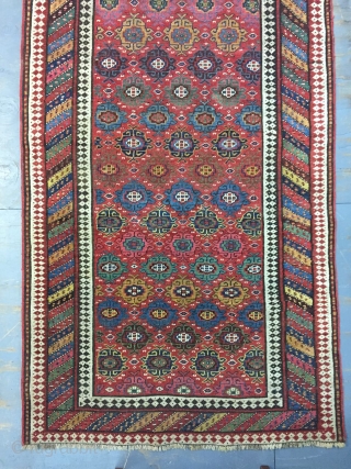 Good Kurdish long rug woven on a wool foundation, Bijar area north west Persia,last quarter 19th ,century,8ft.2in.x4ft.1in.2.49cm.x1.25cm.overall wear with corrosion to Browns,losses to both ends.unusual all over design of rosettes in a  ...