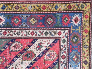 Caucasian Gendje long Rug with diagonal stripes, nice colors (especially the purple), vibrant field with botehs (or earrings), interesting border design with whirling logs?, 4x7.6 ft (122x232 cm), second half 19th century. 