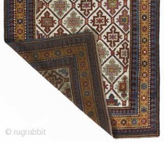 43x100 inches (110x255 cm). An ivory ground Karabagh long rug with a distinctive all over design of integrated shield and cross motifs and an attractive yellow main border of alternating terracotta and  ...