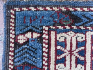 A Splendid blue ground star and rosette Caucaian Kuba runner, wonderful colours, well drawn field and green kufic border, original macrame ends, minor moth damage otherwise full pile, all original no repairs,  ...