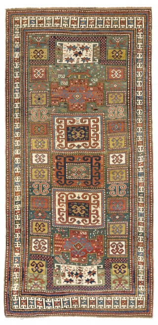 An impressive green ground Karachov (Karachop) Kazak Rug, 4.2 x 8.7 ft  (126x262 cm),  ca 1875.               