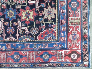 Antique Caucasian Afshan Kuba (Blossom) Rug, 5.10 x 7.9 ft (183x240 cm), navy blue field framed by a red kufic border, good medium pile throughout, dates from 3rd quarter 19th century.  