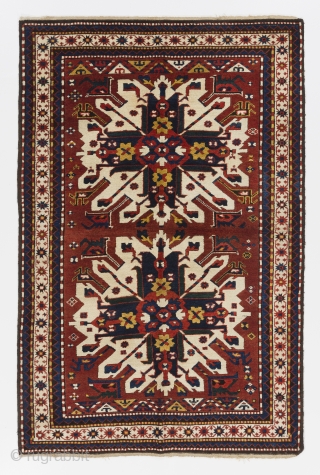 Antique Caucasian Chelaberd Rug, so called "Eagle Kazak" or "Sunburst Kazak" from Karabagh, South Central Caucasus. 4.7 x 6.9 Ft (140x205 cm, no 4386). Full pile, very good condition as found. 

here  ...