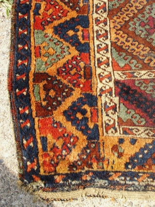 Anatolian Kurdish Yoruk rug. 50X79 Inches... 127X201 Cm. All intact with braided ends. Mostly good pile, some wear, dirty with washable stain and a crease cut as shown.     