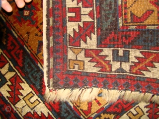 Small yellow ground Caucasian rug dated 1314 (1896)and signed. Size: 31 X 46 inches or 80 X 117 Cm. Good short pile and all original with no repair except for a fingertip  ...