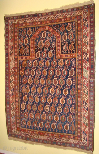 Caucasian Shirvan Prayer rug with abrashed blue field in great shape. 4'2"X5'9" OR 127X175 Cm. plus the original kilim/braded ends. All wool foundation, good short pile. Original sides rewrapped. A light small  ...