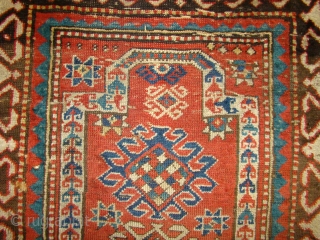 Small Caucasian Kazak Prayer rug. 35"X50"....90X128 Cm. A few small holes and crease wear as shown. Better pile in the border area. All original sides and ends.      