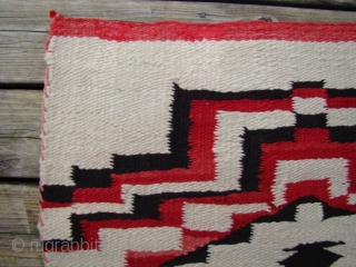 Unusual Navajo weaving that resembles (child's) prayer rugs with stepped prayer arches and stepped diamond mihrabs.
Colors are natural dark brown, natural dark gray plus white and red.
Good wool, great condition.
Size: 20" X  ...