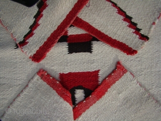 Unusual Navajo weaving that resembles (child's) prayer rugs with stepped prayer arches and stepped diamond mihrabs.
Colors are natural dark brown, natural dark gray plus white and red.
Good wool, great condition.
Size: 20" X  ...