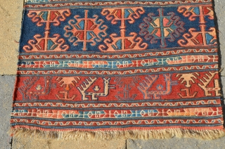 An interesting Soumak mat, actually a pair of bag faces that were put together, each bag measures 23" x 22" making the mat 46" x 22".       